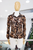 Blusa cheetah destellos