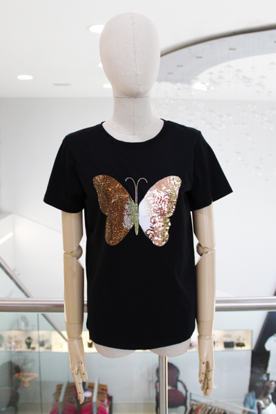 ￼ Playera negra mariposa ￼