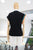 Blusa negra mascada